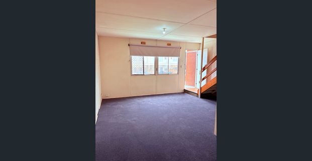 Two-storey, two-bedroom unit - Photo 1