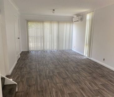 Two Bedroom Townhouse in Ideal Location - Photo 1