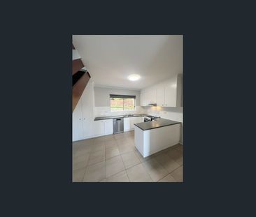 Fully Renovated Townhouse in Ideal Location - Photo 1