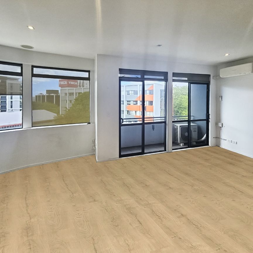 Large two bedroom unit comes with secure carpark on Pitt Street - Photo 1