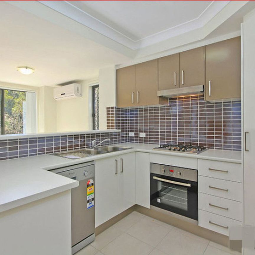 MODERN END UNIT TOWNHOUSE IN A SMALL QUIET COMPLEX - Photo 1