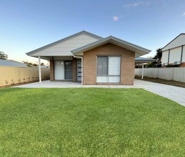 Stylish Modern Home with Ducted A/C & Water Included - Photo 6