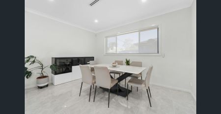 Modern Five-Bedroom Family Home with Spacious Living & Outdoor Entertaining - Photo 3