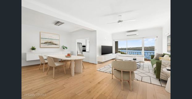 Stylish boutique sub-penthouse with a glistening harbour backdrop - Photo 1
