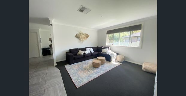 Modern 4-Bedroom Home in a Quiet Area - Photo 1
