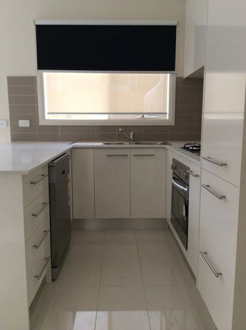 Register to Inspect // Stylish Two-Bedroom Townhouse with Dual Living Spaces - Photo 5