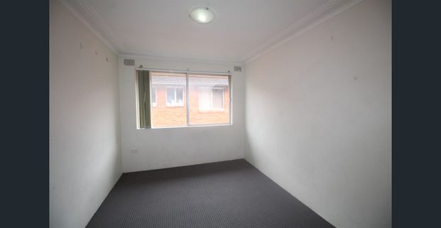 TWO BEDROOM UNIT - TOP FLOOR WITH GARAGE - Photo 1