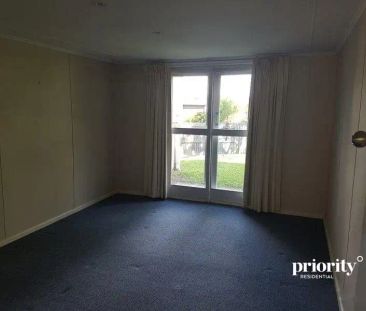 “Neat 4-Bedroom Home - Peaceful Living with Room to Move!” - Photo 3
