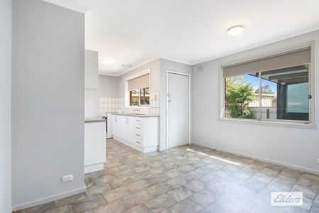 Charming 3-Bedroom Home with Modern Comforts & Outdoor Storage - Photo 5