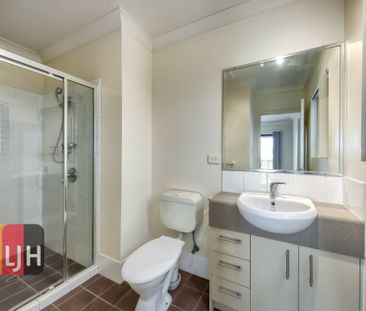 TOP FLOOR THREE BEDROOM UNIT WITH DOUBLE GARAGE & LARGE DECK! - Photo 2