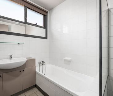 Unique Mezzanine-Style Unit with Spacious Living and Private Courtyard - Photo 5