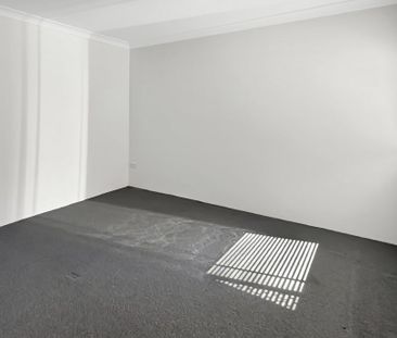 Spacious Two-Bedroom Unit with Tandem Lock-Up Garage - Photo 2