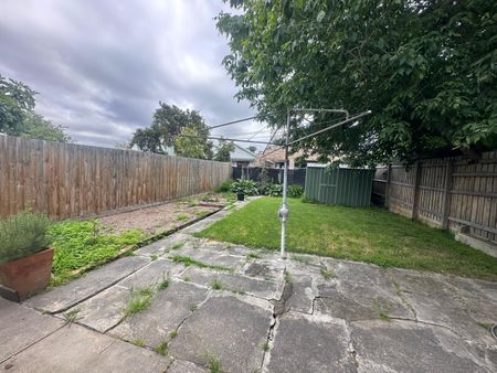 Spacious 3-Bedroom Home with Sunroom & Great Backyard - Photo 4