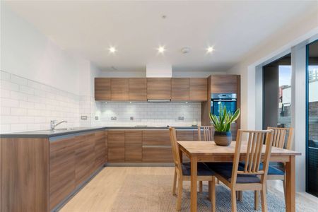 A stunning two bedroom, two bathroom flat located on the first floor of a modern development on Barking Road. - Photo 2