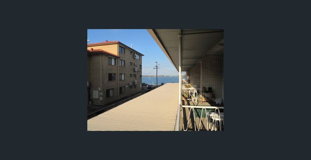 TOWNHOUSE STYLE UNIT OVERLOOKING THE BROADWATER - Photo 1