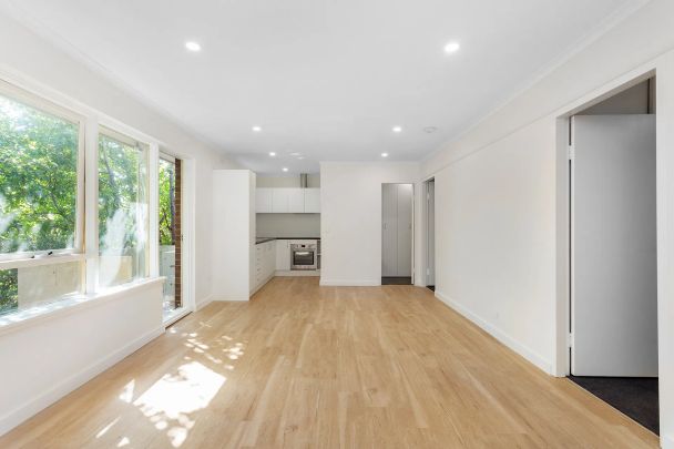 SUNLIT SANCTUARY IN THE HEART OF SANDY VILLAGE - Photo 1