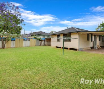 Neat 4 Bedroom Home with Comfort & Convenience - Photo 1