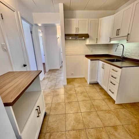 SUPERBE 4 1/2 en coin rénové avec goût! Piscines, gym, internet compris! - Photo 1