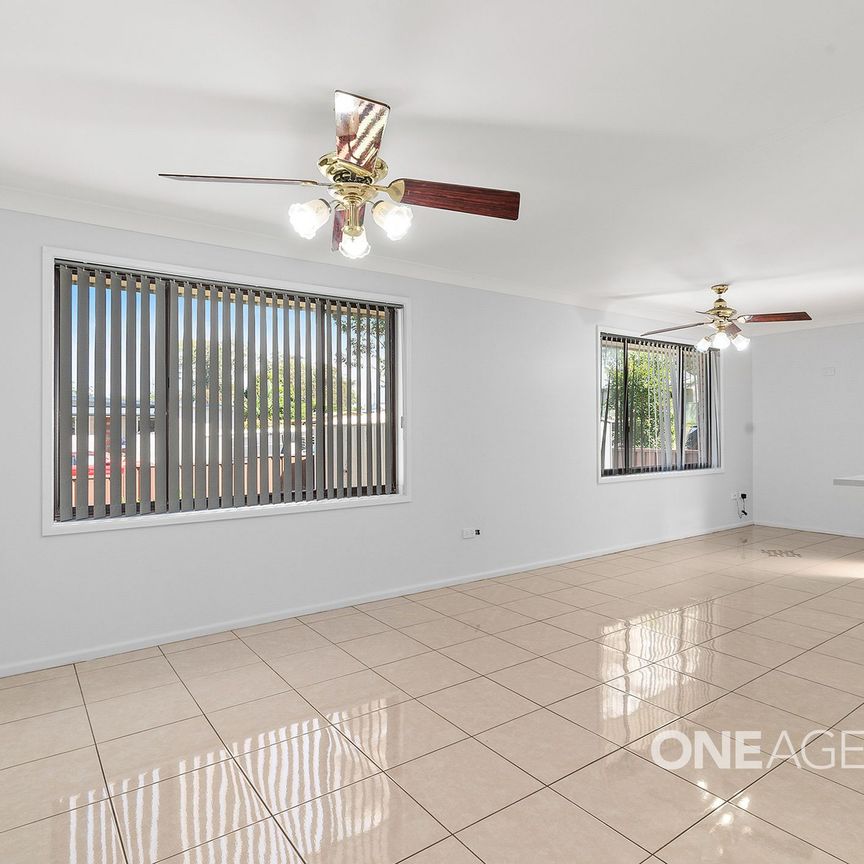 NEWLY PAINTED 3-BEDROOM WITH LARGE CARPORT - Photo 1
