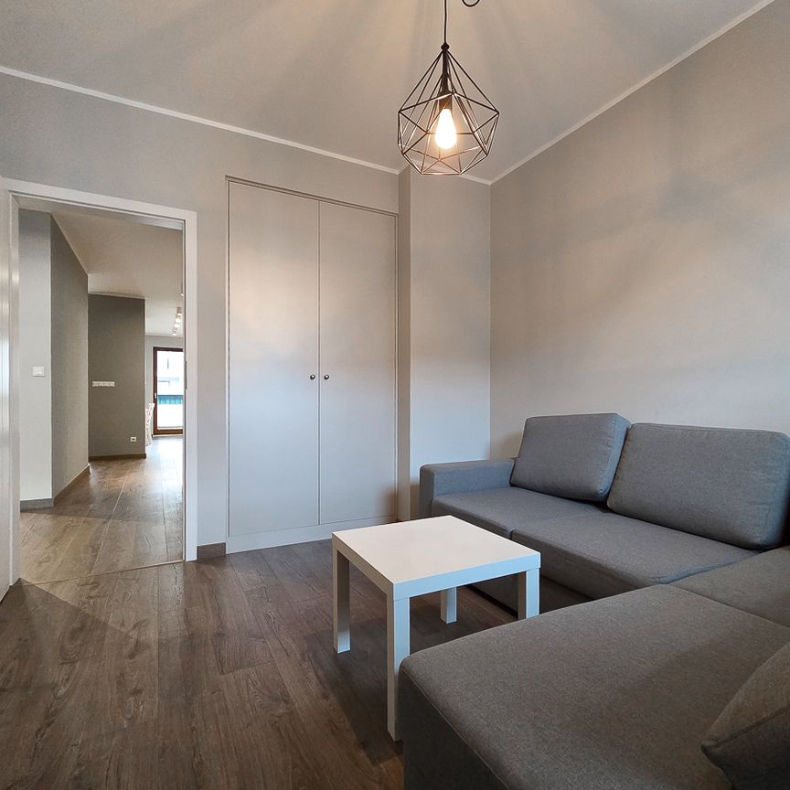 Salon z ceglaną ścianą apartament Maratońska Poznań - Фото 1