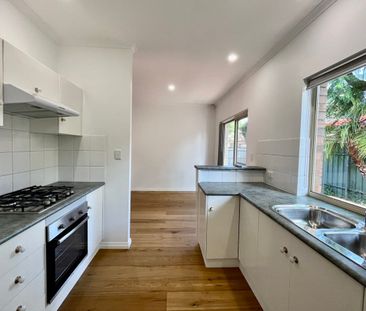 Stylish, Light-Filled Living in a Prime Location - Photo 1