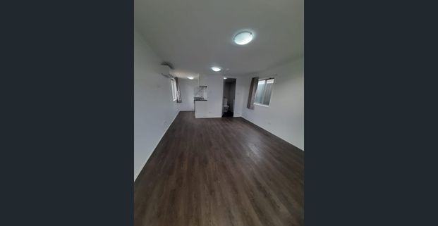 STREET FRONTAGE, PRVIATE ENTRY & CARPORT! - Photo 1