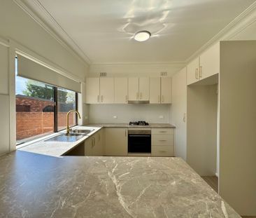 MODERN FAMILY HOME WITH MULTIPLE LIVING SPACES! - Photo 2