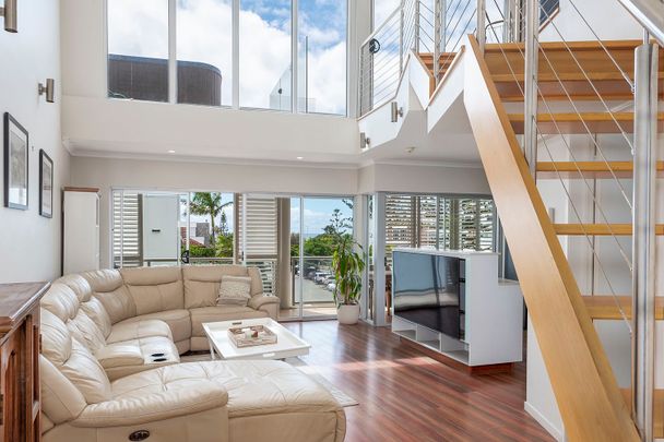 Elevated Coastal Lifestyle moments from the beach - Photo 1