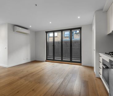 Modern Two-Bedroom Apartment in Prime Location - Photo 1