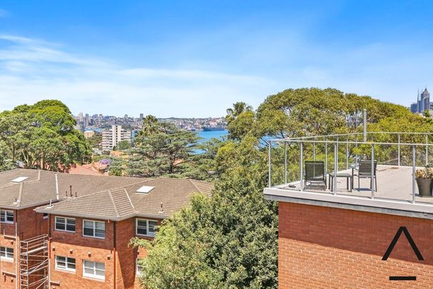 Top floor one bedroom apartment with glimpse of water views - Photo 1
