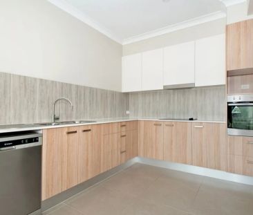 Stylish Three-Bedroom Townhome in Prime Location - Photo 5