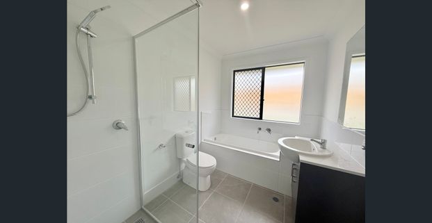 Brand New 4 Bedroom Home in a Prime Location! - Photo 1