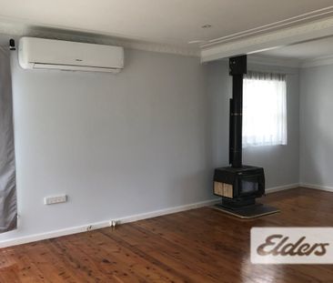 Convenient Home with Modern Kitchen & Bathroom - Photo 1