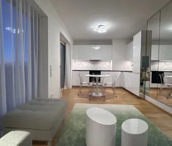Erstbezug | Dachgeschoss mit Weitblick & Sonnenuntergang | Voll möblierte Dachgeschosswohnung mit 13 m² Terrase & Tiefgaragenstellplatz möglich | Village im Dritten | 7. OG - Photo 1