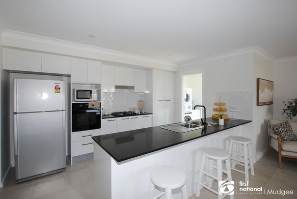 Modern, Fully Furnished Family Home with Space, Style & Comfort - Photo 1