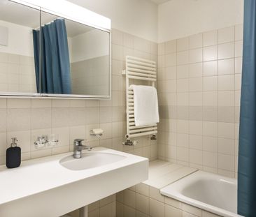 Moderne 5.5-Attikawohnung an zentraler Lage - Photo 1