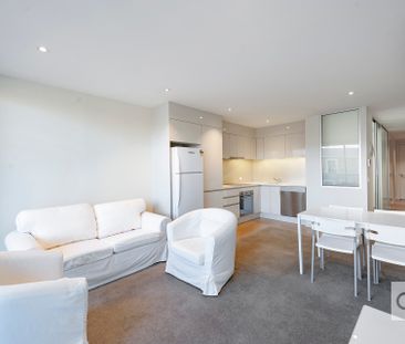 Open the Door to Effortless City Living with Stylish Furnished Comfort - Photo 2