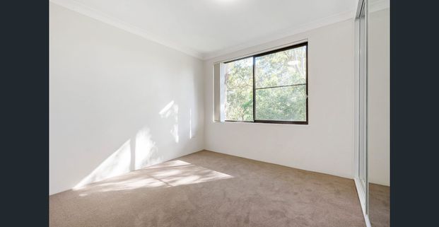 Conveniently located and spacious two bedroom unit - Photo 1