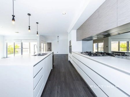 “Spacious 4-Bedroom Family Home with Pool – Walk to Burns Beach” - Photo 4