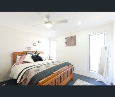 Situated in the quiet suburb of Springfield Lakes, this beautiful p... - Photo 1