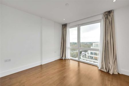 Situated on the eleventh floor, the property enjoys the benefit of a private balcony as well as access to the communal grounds of the development which overlook the river and Canbury Gardens - Photo 3