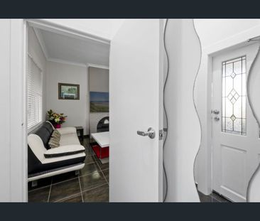 Stylish Two-Level Living in a Prime South-East Location - Photo 1