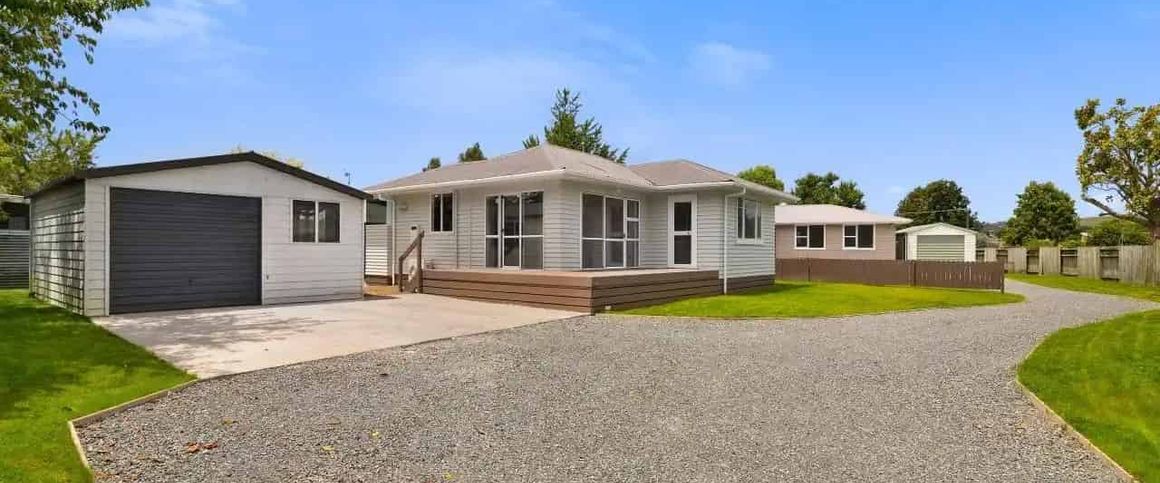 Tidy Family Home with Garage - Photo 1