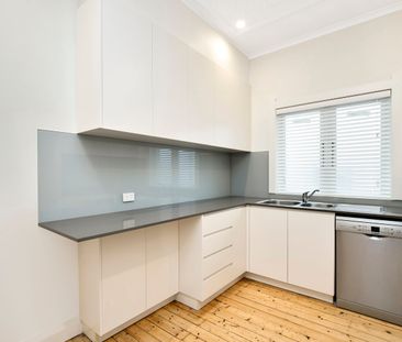 Charming Character Apartment with Sunroom & Garage - Photo 3