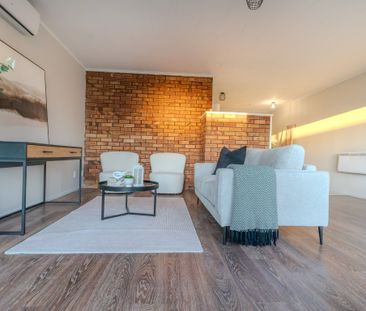 This newly renovated 2-bedroom unit offers modern, low-maintenance ... - Photo 2