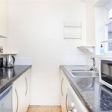 **RENT INCLUDES WATER BILL** A superb 1 bedroom upper floor furnished apartment within a short stroll into the city centre. - Photo 4