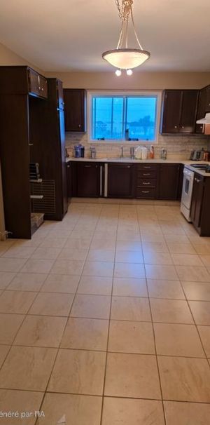 logement 5 1/2 à louer - Photo 1