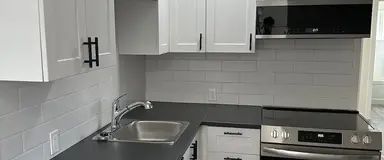 Iner City Extensively Renovated 4PLEX LOWER SUITE with 2bed+DEN WITH CITY VIEWS! | 2833 15 Avenue Southeast, Calgary - Photo 1