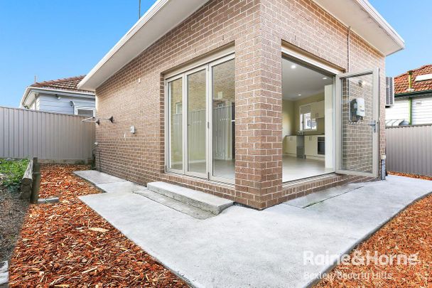 Modern two-bedroom home (6 MONTH LEASE ONLY) - Photo 1