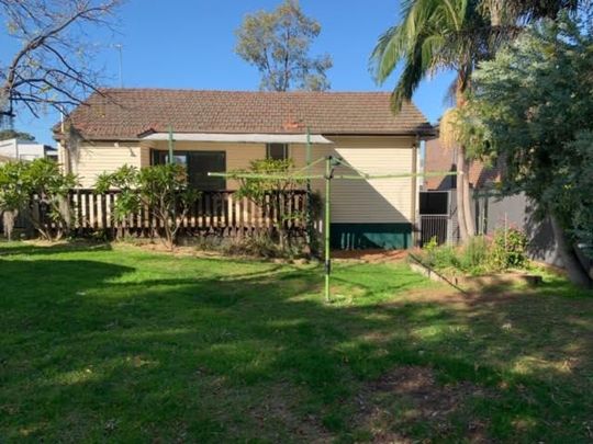 Charming Family Home with Spacious Backyard and Modern Comforts - Photo 1